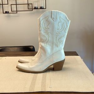 White snip toe cowboy boots.
